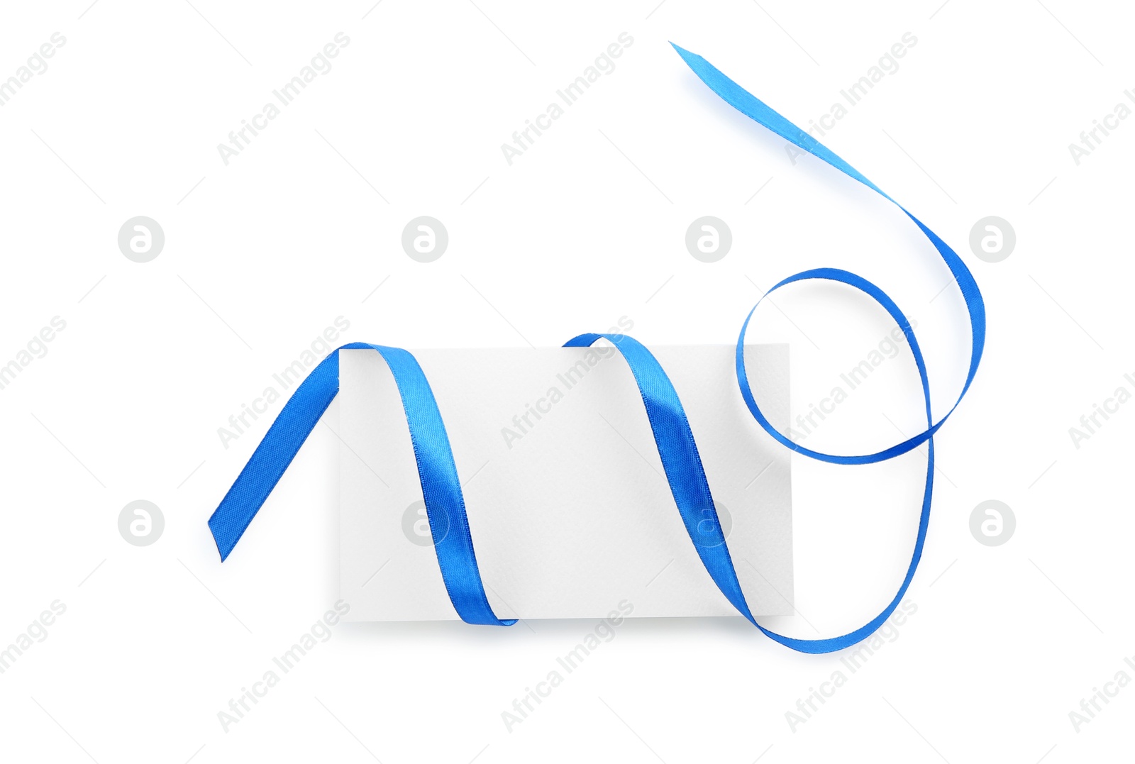 Photo of Blank card and blue ribbon isolated on white, top view