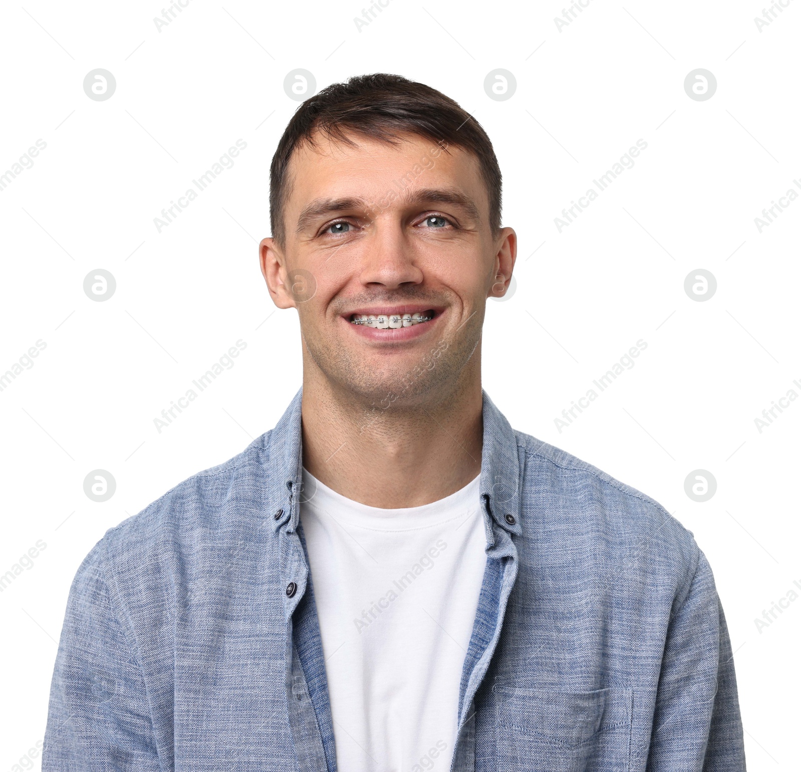 Photo of Smiling man with dental braces on white background