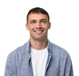 Smiling man with dental braces on white background