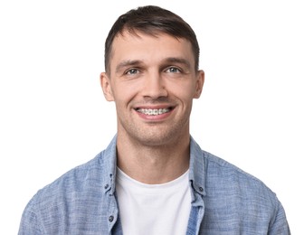 Photo of Smiling man with dental braces on white background