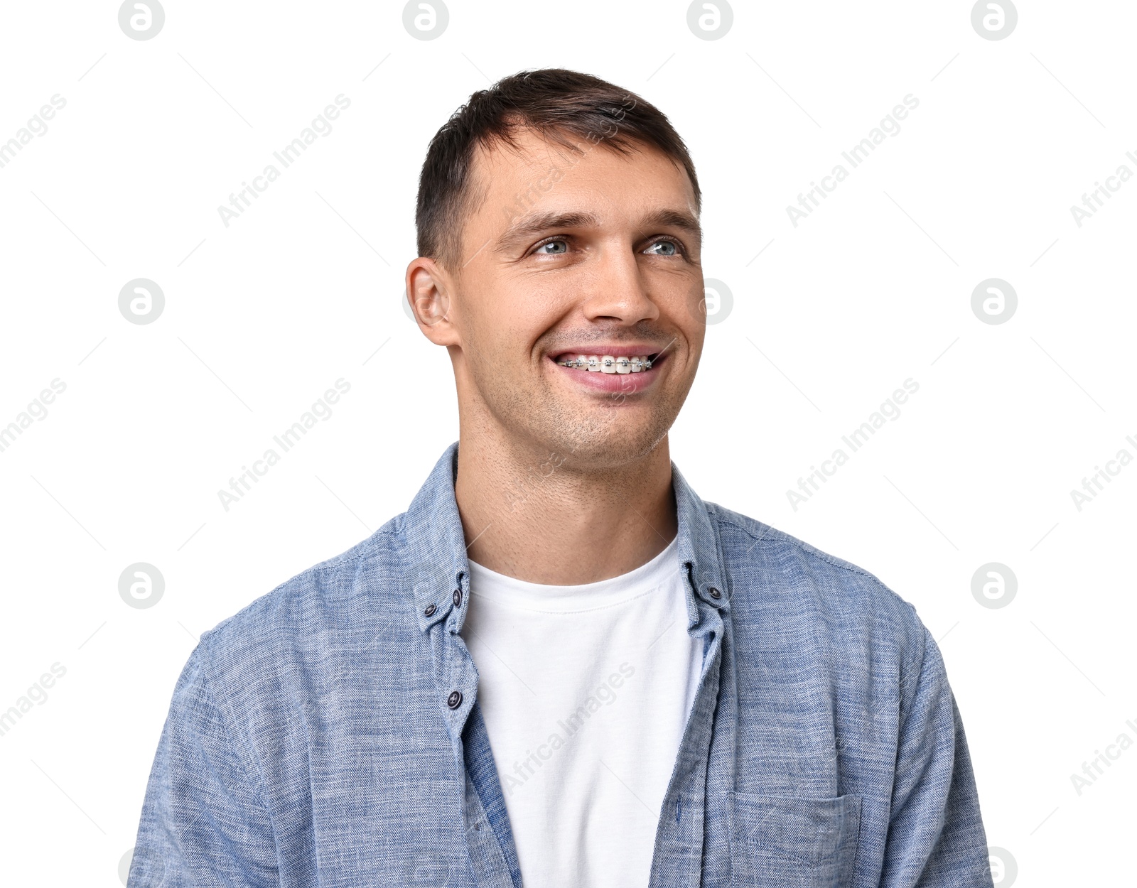 Photo of Smiling man with dental braces on white background