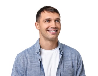 Photo of Smiling man with dental braces on white background