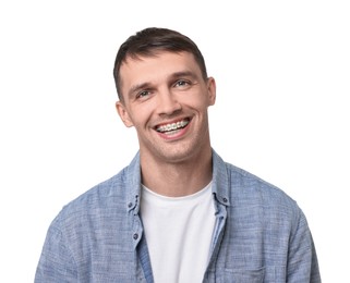 Photo of Smiling man with dental braces on white background