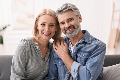 Photo of Portrait of happy middle aged couple at home