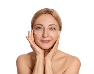 Beautiful woman with cream on face against white background