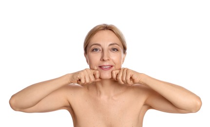 Photo of Smiling woman doing facial self massage on white background