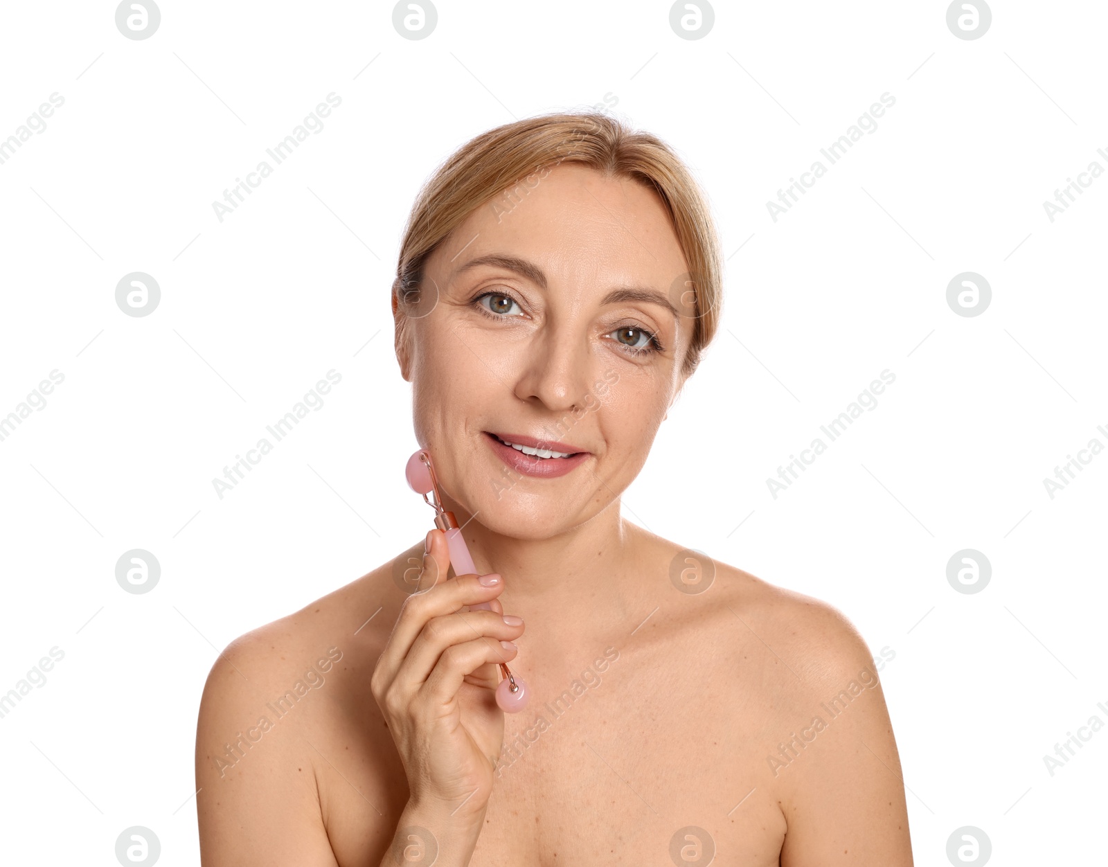 Photo of Smiling woman doing facial self massage with roller on white background