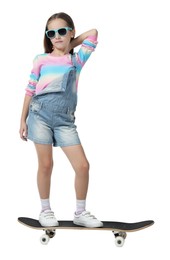 Photo of Stylish girl in glasses standing on skateboard against white background