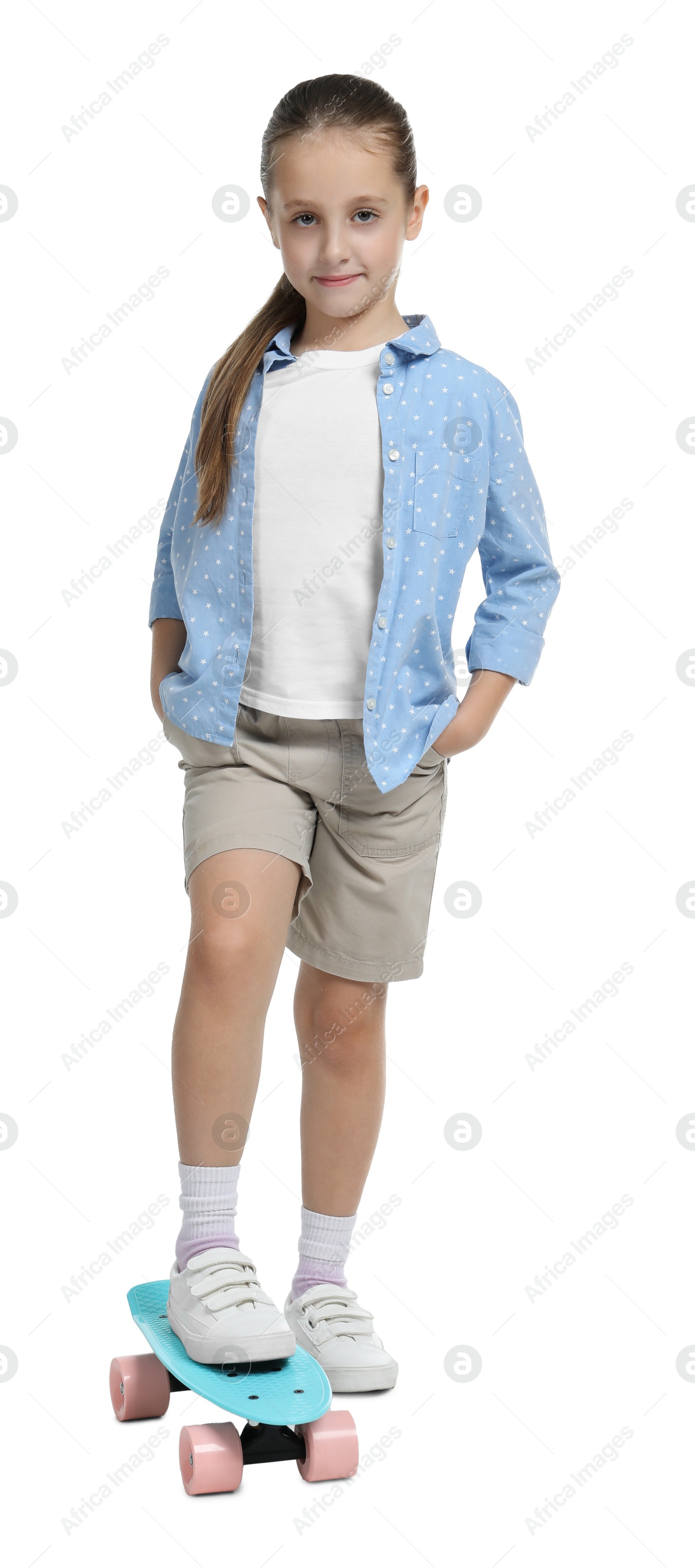 Photo of Little girl with penny board on white background