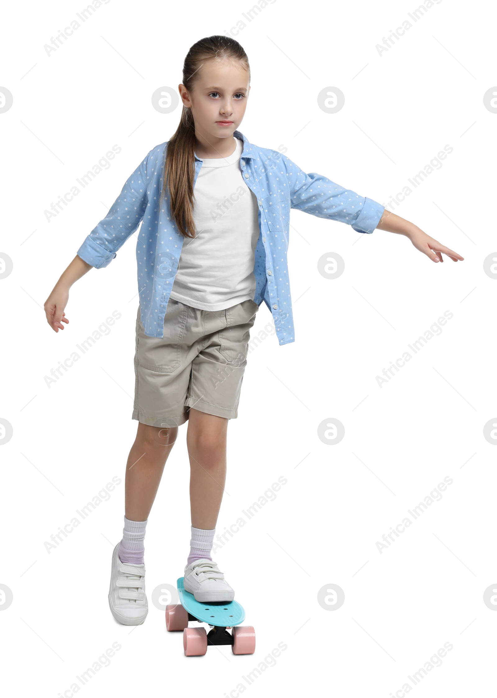 Photo of Little girl with penny board on white background