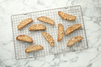 Traditional Italian almond biscuits (Cantucci) on white marble table, top view