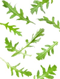 Image of Fresh green arugula in air on white background