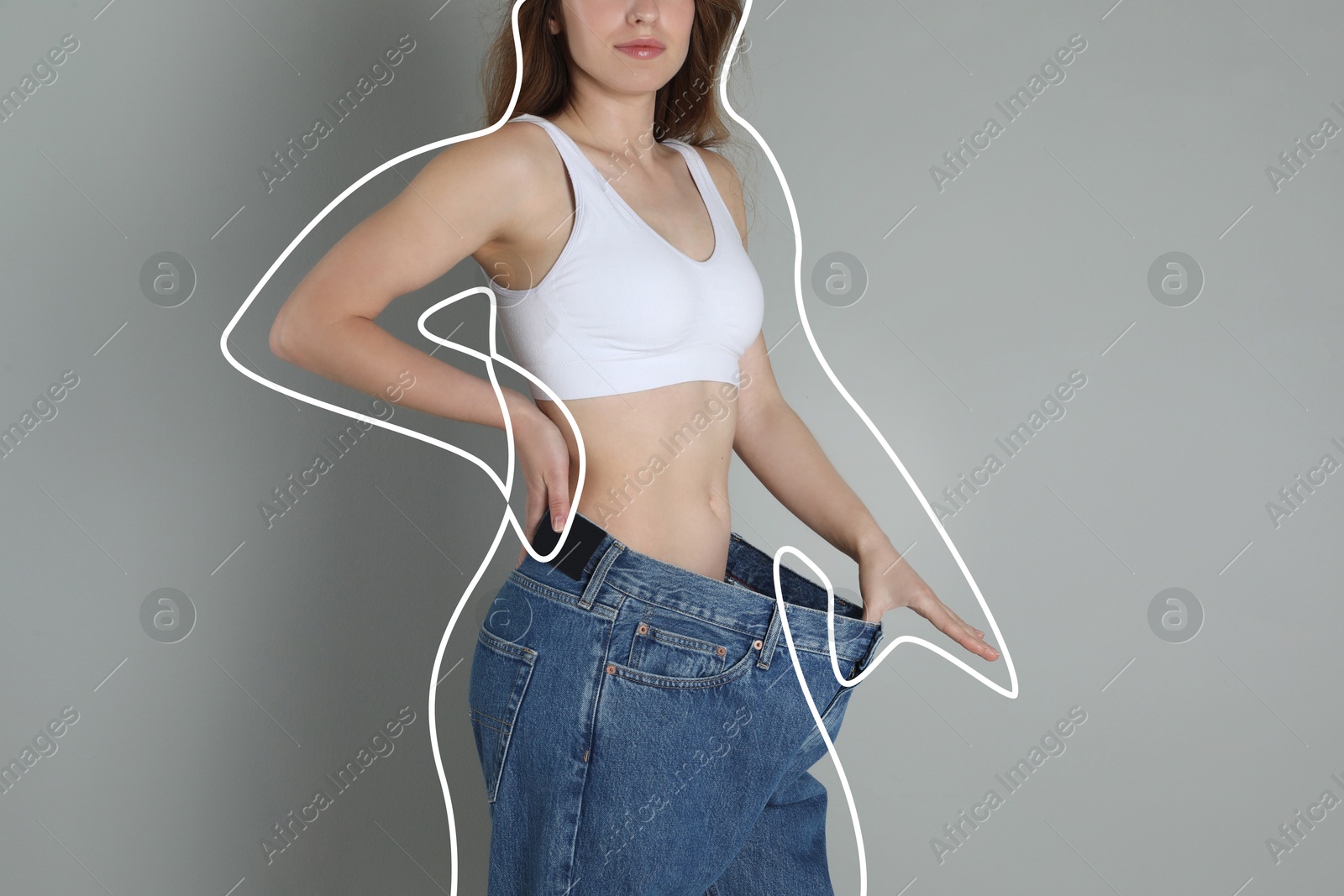 Image of Woman in big jeans showing her slim body on grey background, closeup. Line around repeating her figure