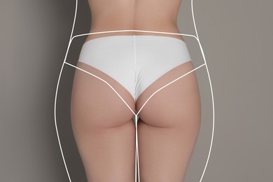 Woman with slim body posing on grey background, closeup. Back view. Line repeating her figure