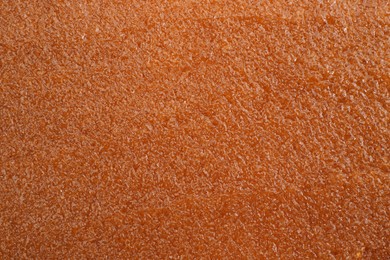 Photo of Sample of natural body scrub as background, closeup