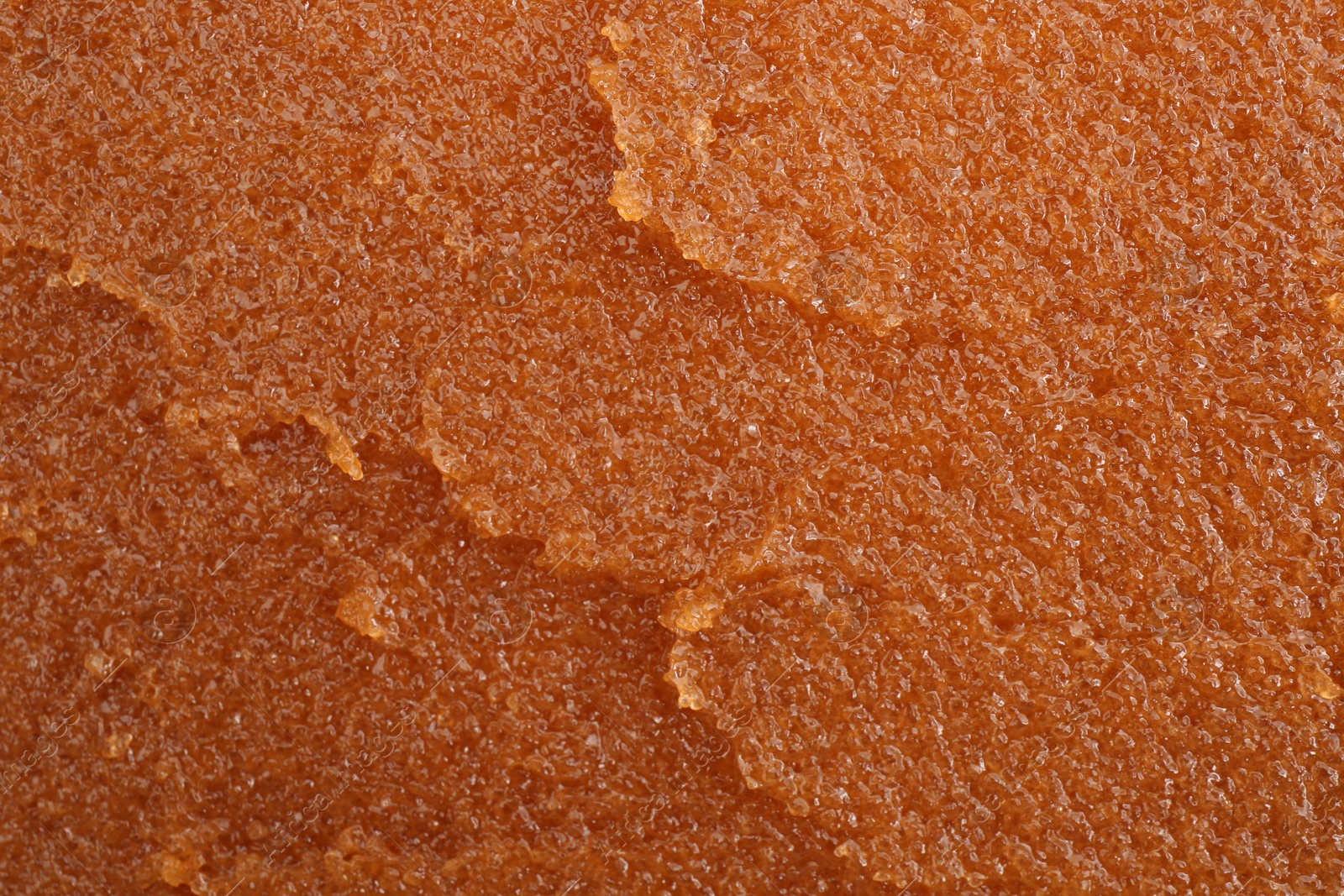 Photo of Sample of natural body scrub as background, closeup