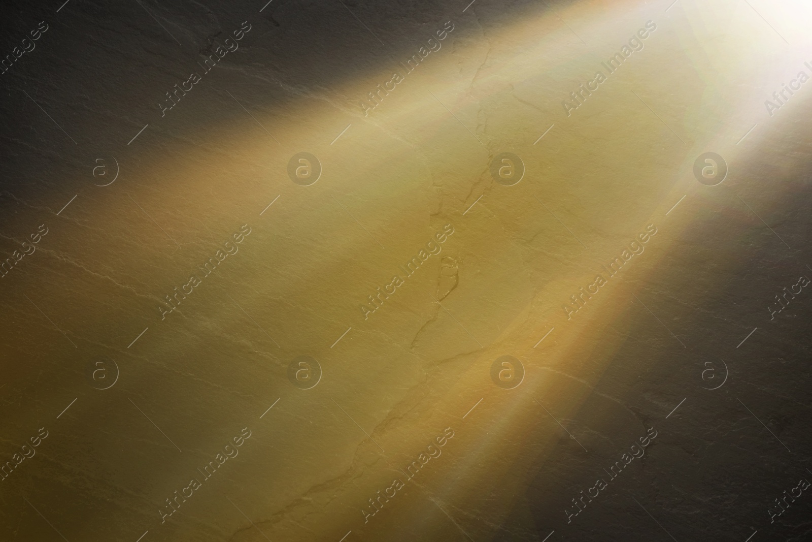 Image of Ray of bright divine light in darkness