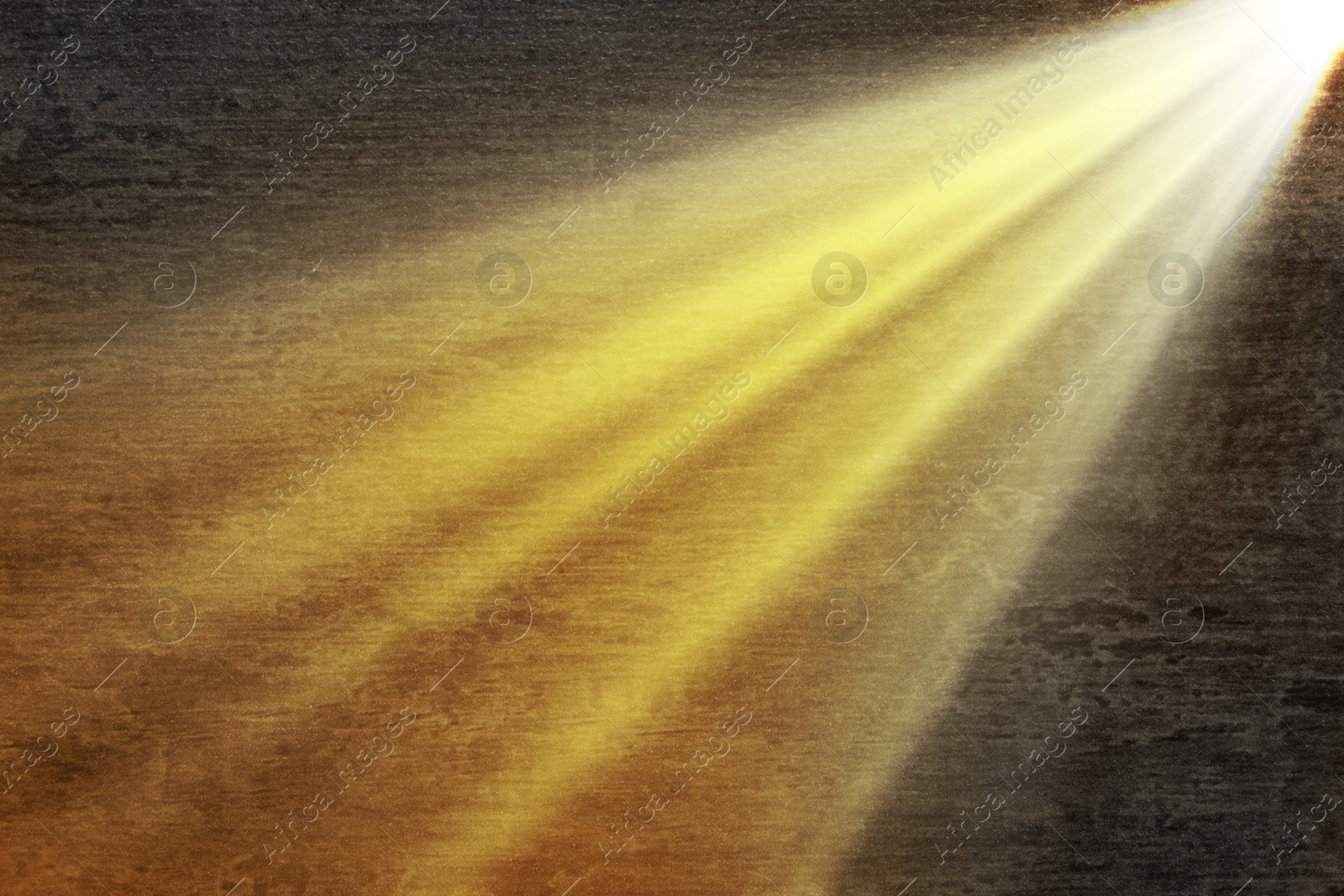 Image of Ray of bright divine light in darkness