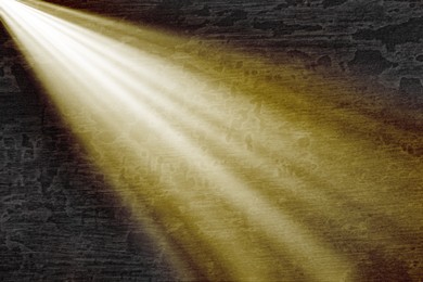 Image of Ray of bright divine light in darkness