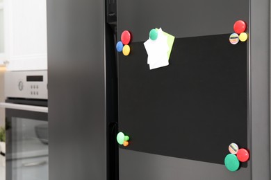 Blank magnetic board with notes on refrigerator in kitchen