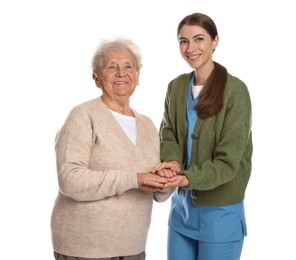 Caregiver supporting senior woman on white background. Home health care service