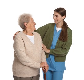 Photo of Caregiver supporting senior woman with walking cane on white background. Home health care service