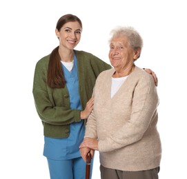 Photo of Caregiver supporting senior woman with walking cane on white background. Home health care service