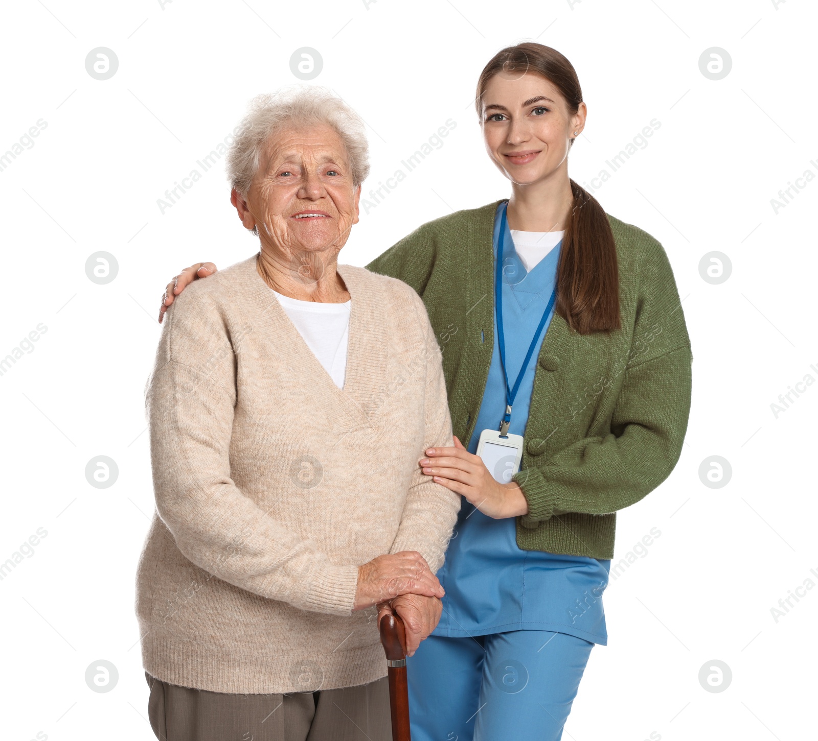 Photo of Caregiver supporting senior woman with walking cane on white background. Home health care service