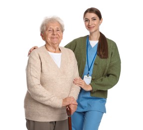 Photo of Caregiver supporting senior woman with walking cane on white background. Home health care service