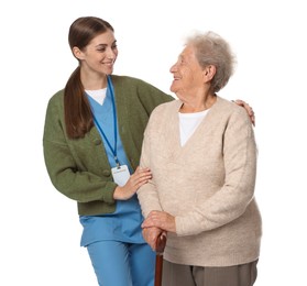 Caregiver supporting senior woman with walking cane on white background. Home health care service