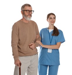 Caregiver supporting senior man with walking cane on white background. Home health care service