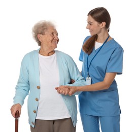 Caregiver supporting senior woman with walking cane on white background. Home health care service