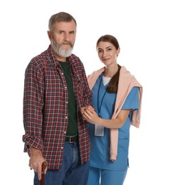 Photo of Caregiver supporting senior man with walking cane on white background. Home health care service