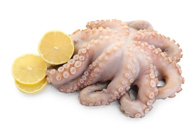 Photo of One fresh raw octopus and lemon slices isolated on white