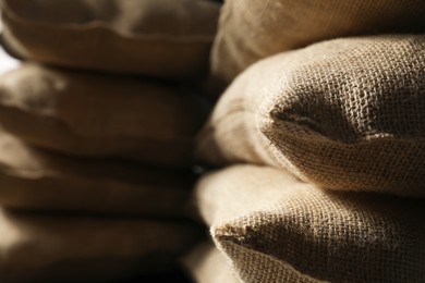 Closeup view of many natural burlap sacks