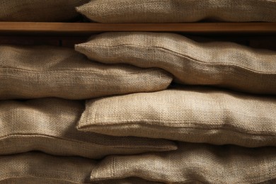 Group of burlap sacks on shelving unit, closeup