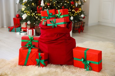 Photo of Santa bag full of Christmas presents at home