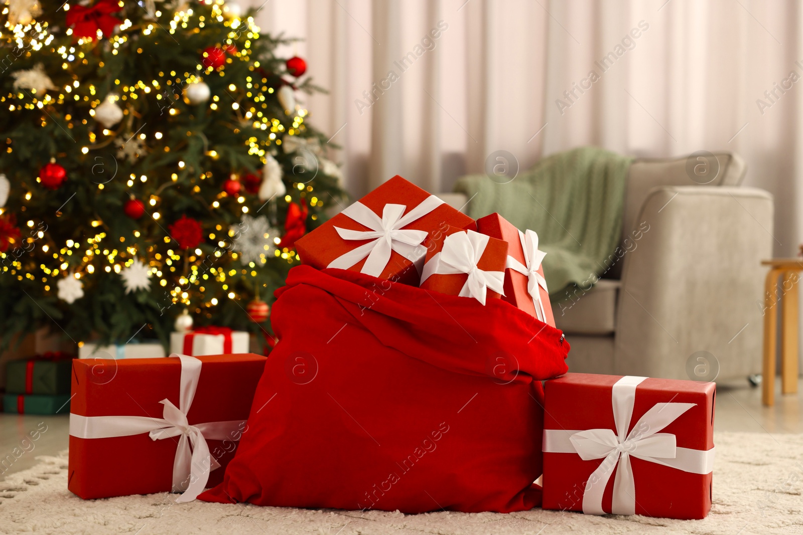 Photo of Santa bag full of Christmas presents at home