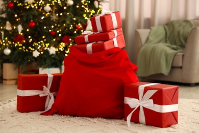 Photo of Santa bag full of Christmas presents at home