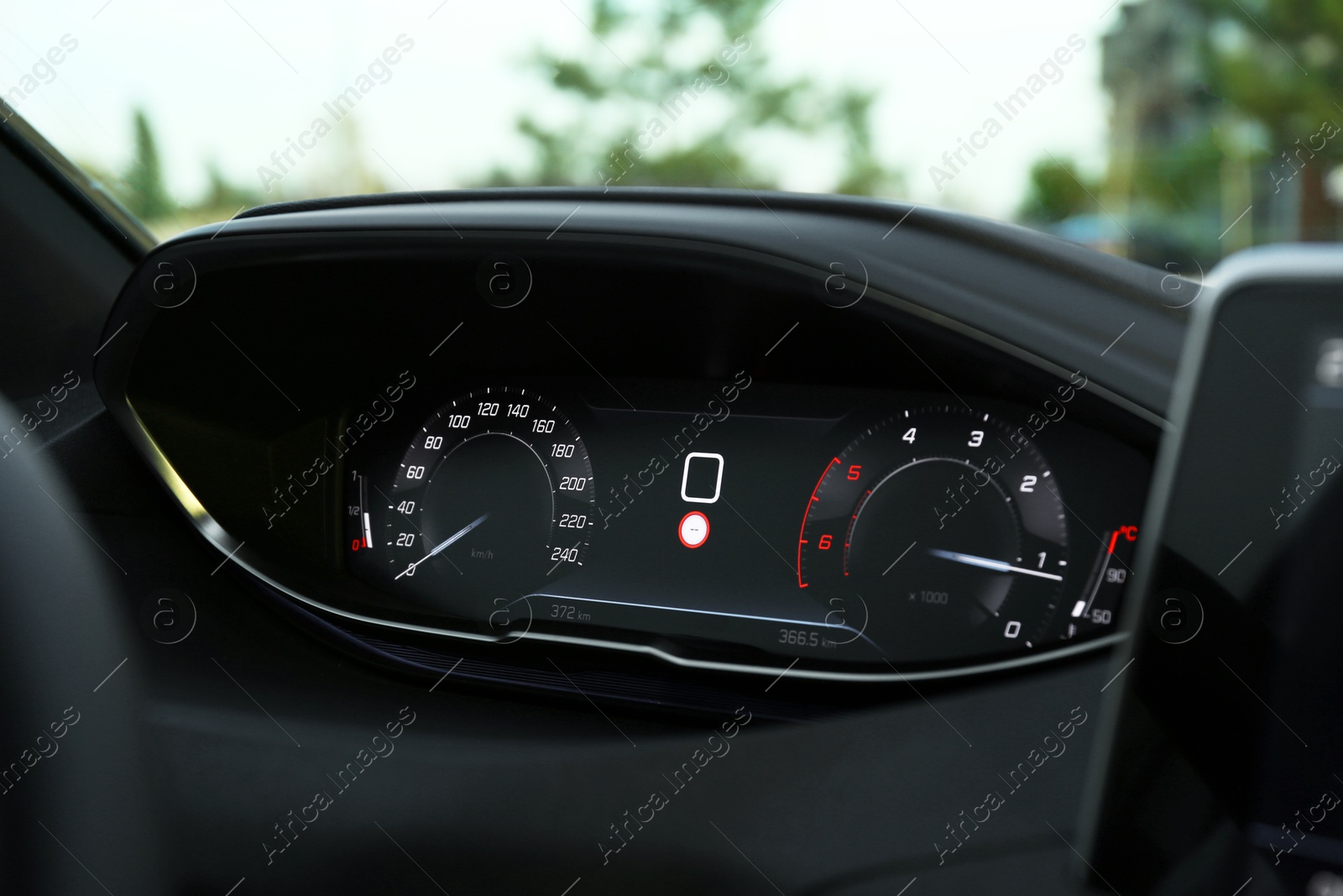 Photo of Speedometer on dashboard inside of modern luxury car, closeup