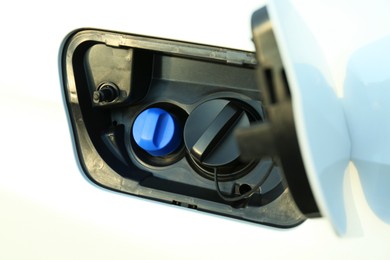 Photo of Closeup view of open car fuel flap