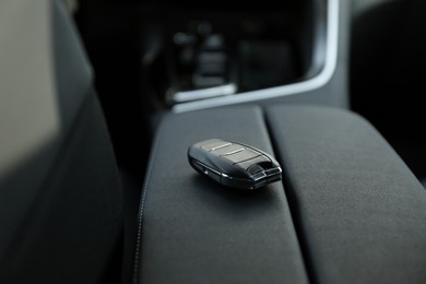 Photo of Car flip key inside of modern automobile, closeup