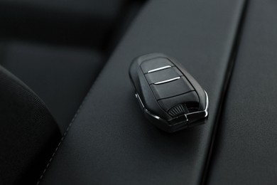 Photo of Car flip key inside of modern automobile, closeup