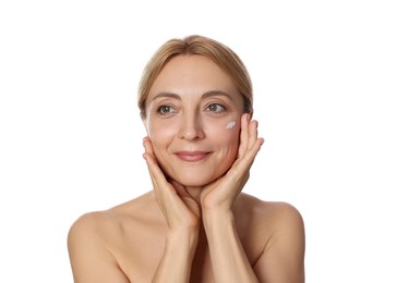 Beautiful woman with cream on face against white background