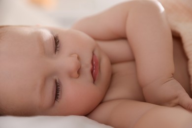 Photo of Cute little baby sleeping on bed at home