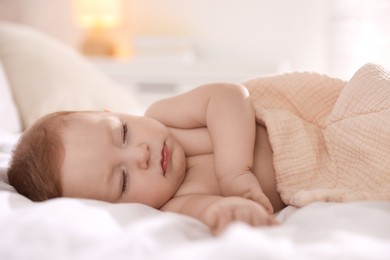 Photo of Cute little baby sleeping on bed at home