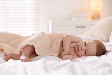 Photo of Cute little baby sleeping on bed at home