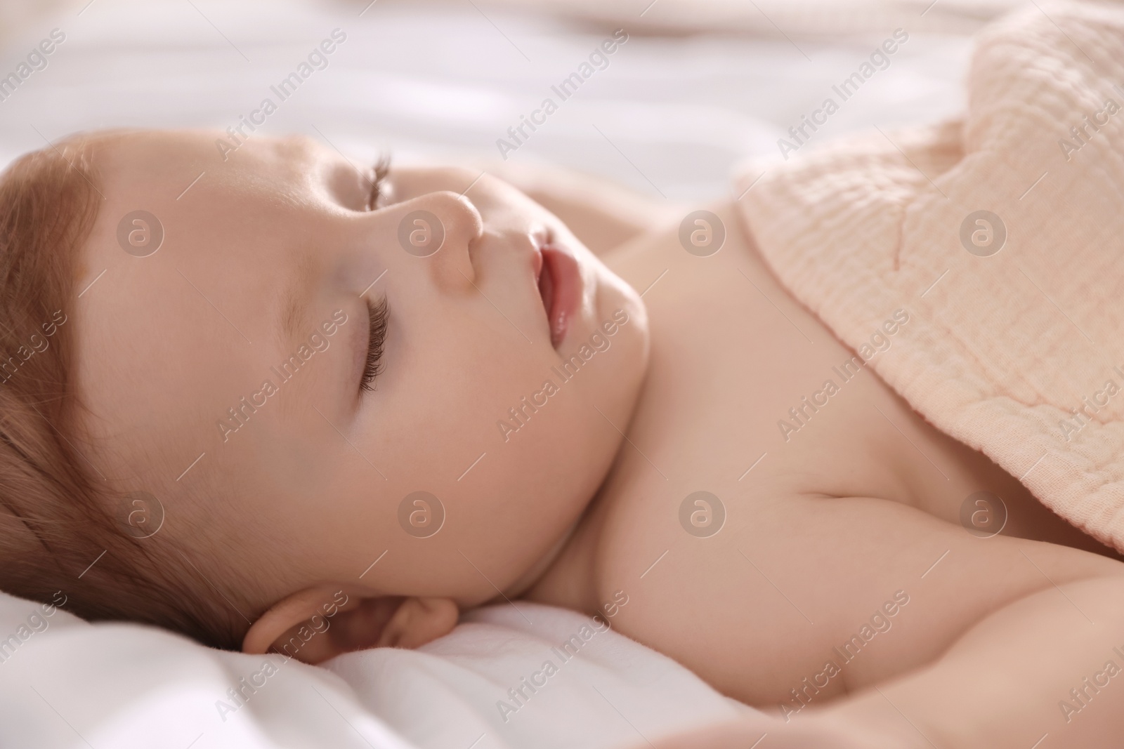 Photo of Cute little baby sleeping on bed at home