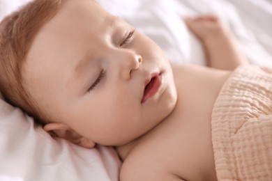 Photo of Cute little baby sleeping on bed at home