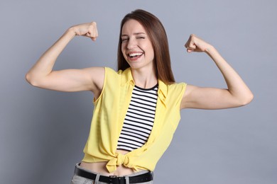 Photo of Portrait of happy winner on gray background